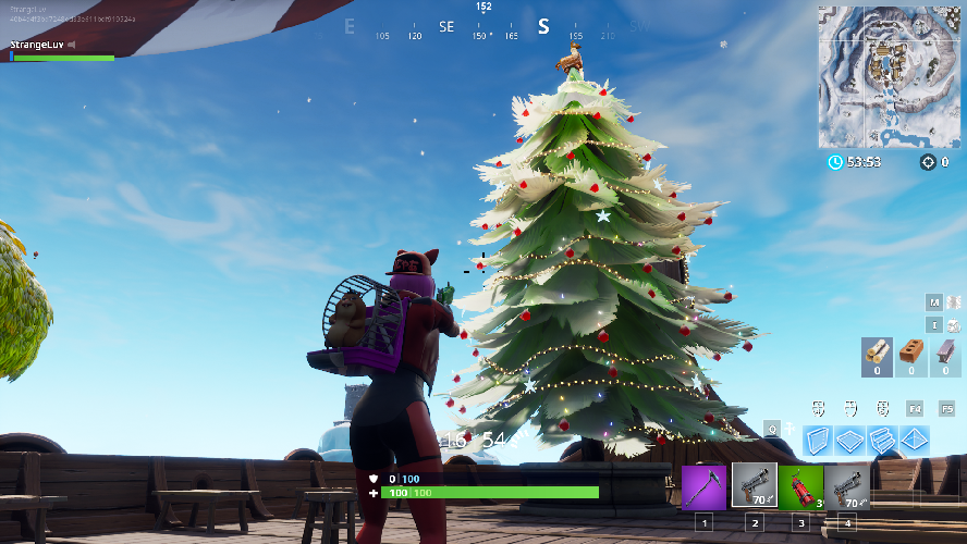 Fortnite dance in front of holiday trees