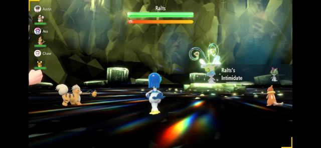 Pokemon Scarlet & Violet screenshot of a shiny Ralts in a bug-type tera raid battle