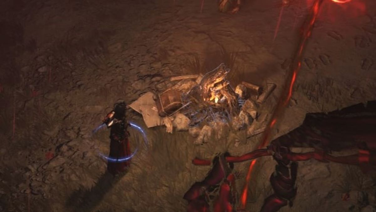 Diablo 4 screenshot of a black robed and hooded character standing beside a campfire.