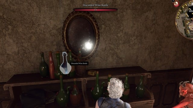 BG3 screenshot of Astarion looking at the Discarded Wine Bottle on a shelf beneath a mirror in Elfsong Tavern
