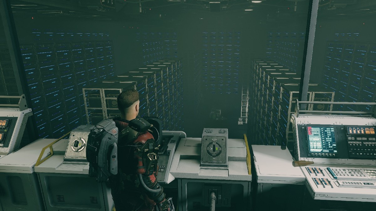 Starfield screenshot of player character in front of a console control overlooking a large storage house.