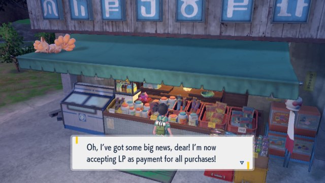 A Pokémon Scarlet and Violet: The Teal Mask screenshot of the player in front of Peachy's store. The dialogue reads, "Oh, I've got some big news, dear! I'm now accepting LP as payment for all purchases!"