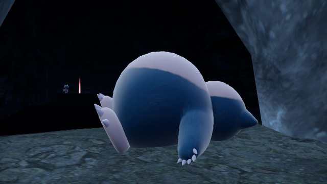 Pokemon Scarlet and Violet Teal Mask screenshot of Snorlax resting at cave entrance