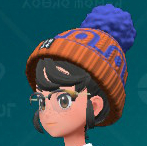 A screenshot of a patterned Pom Pom Beanie from Pokémon Scarlet and Violet: The Teal Mask.