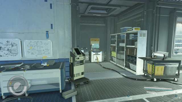 Starfield screenshot of a small corridor with a cable connected to a terminal beneath a yellow sign that says CAUTION