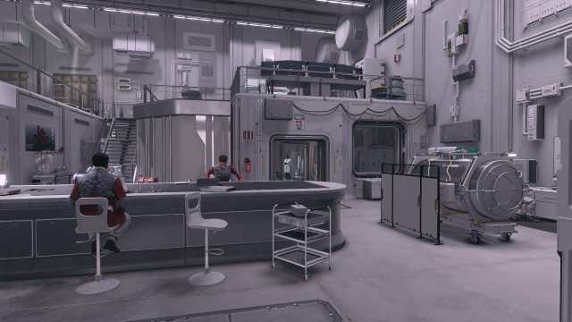 Starfield screenshot of two people sitting at a table in the Ryujin Industry research and development lab. 
