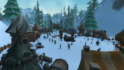 A snowy scene of the World of Warcraft Brewfest event, which takes place outside Ironforge City. Tents and fences surround players and NPCs as they engage in festivities.