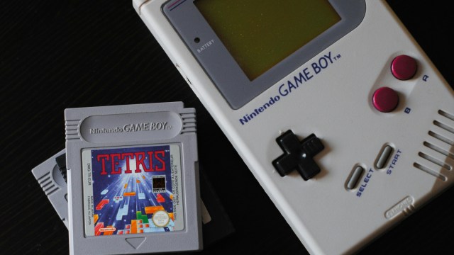 A photograph of a Game Boy and a Tetris cartridge.