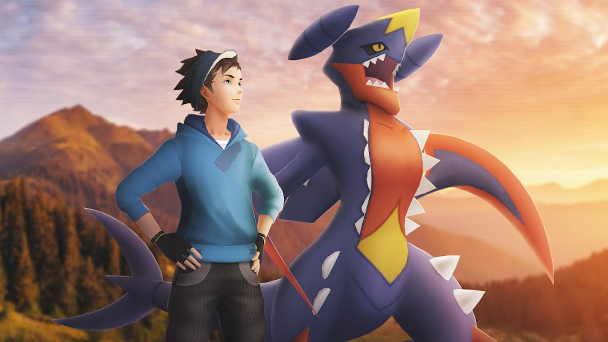 An official image of a Trainer with Mega Garchomp in Pokémon GO.