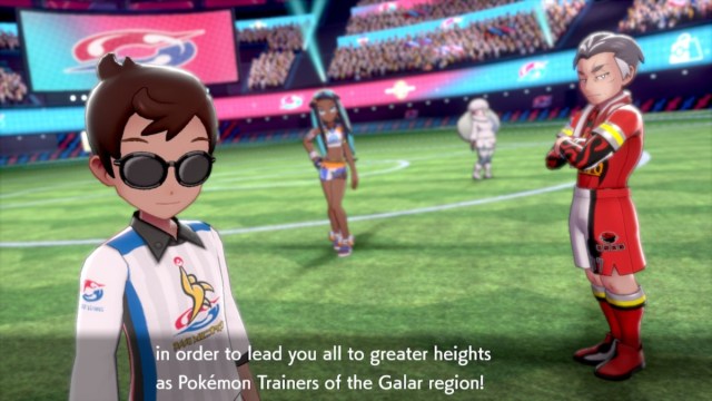 Pokemon Sword and Shield gym leaders and player character standing in Motostoke Stadium for the Champion Cup Finals
