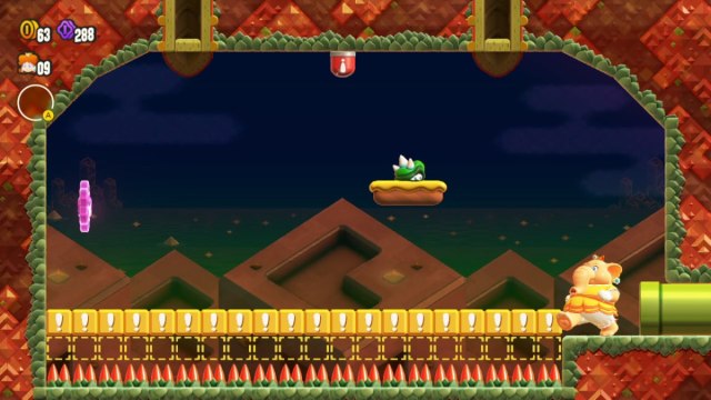A Super Mario Bros. Wonder screenshot of Elephant Daisy in a room with Exclamation Blocks leading to a purple Flower Coin.