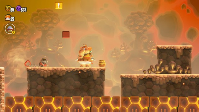 A Super Mario Bros. Wonder screenshot of Elephant Daisy beneath exclamation and question blocks.