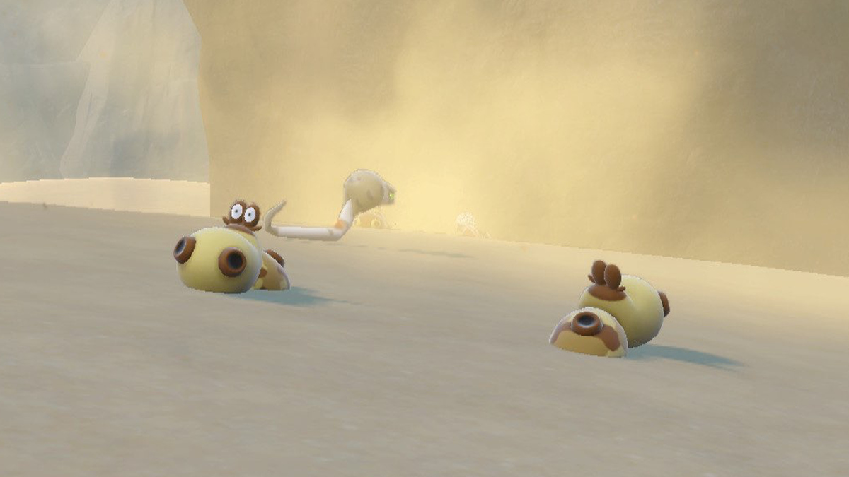 A Pokemon Scarlet and Violet screenshot of Hippopotas and Silicobra in Asado Desert.
