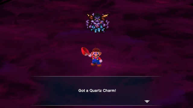 A Super Mario RPG screenshot of Mario receiving the Quartz Charm.