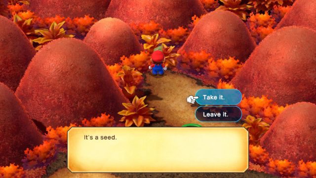 A Super Mario RPG screenshot of Mario picking up a Seed.