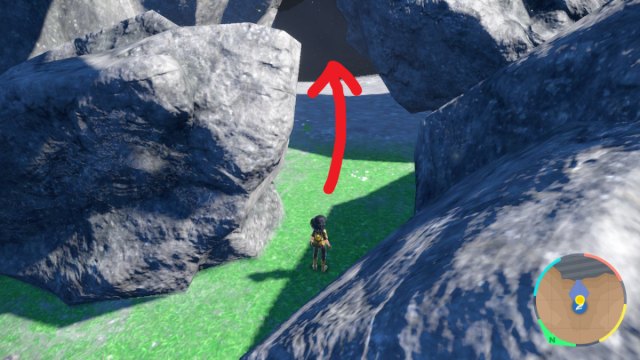 A Pokemon Scarlet and Violet screenshot of Area Zero. A red arrow points to the mouth of a cave hidden between rock formations.