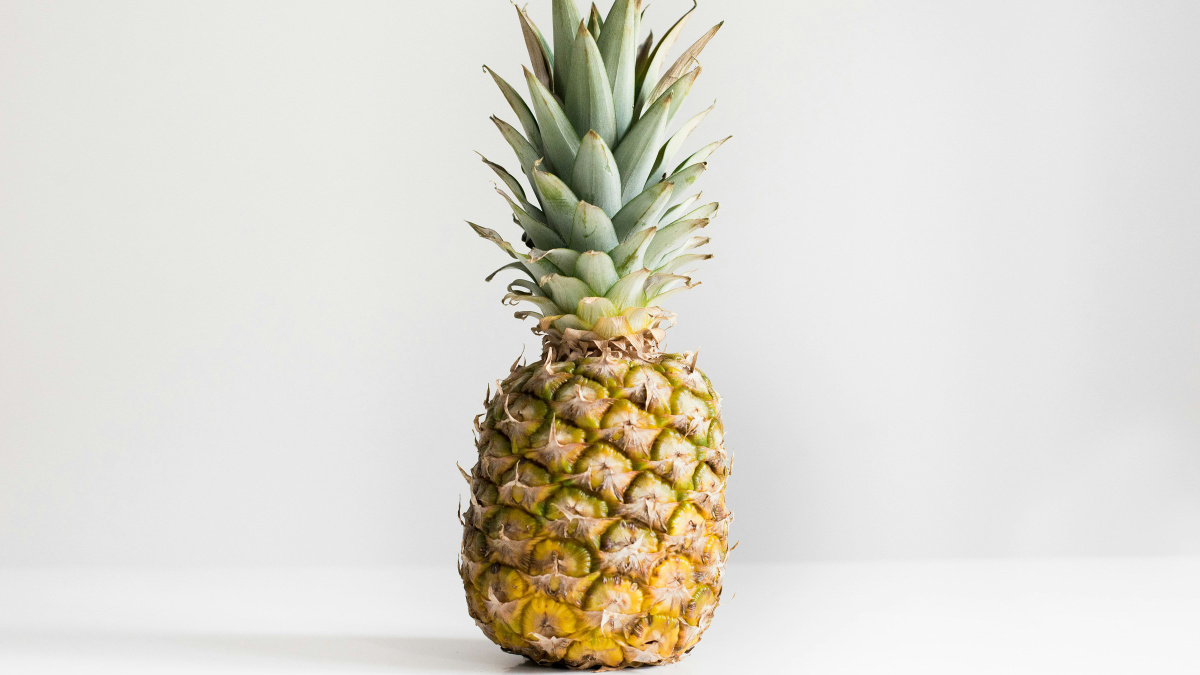A photograph of a pineapple on a white background.