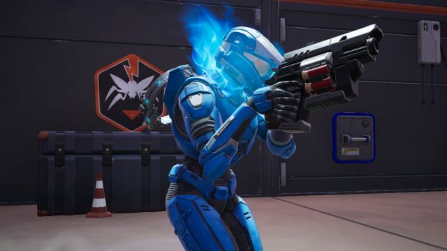 A blue spartan holding a gun in an oxr bunker in fortnite