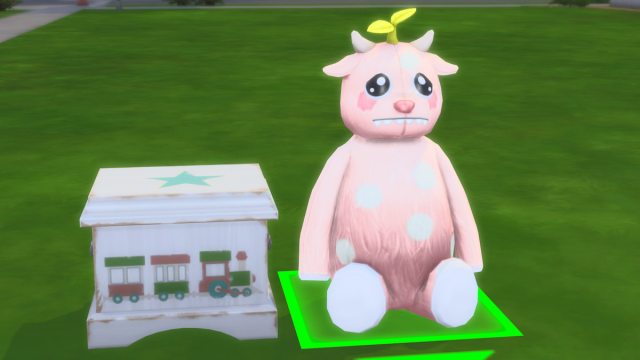 hovering over draggable pink stuffed animal in the sims 4