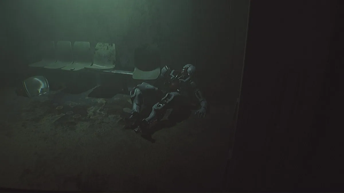 A normal robot is lying deactivated without a head