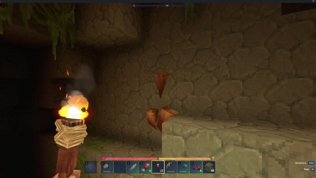 Hytale holding torch in front of copper ore