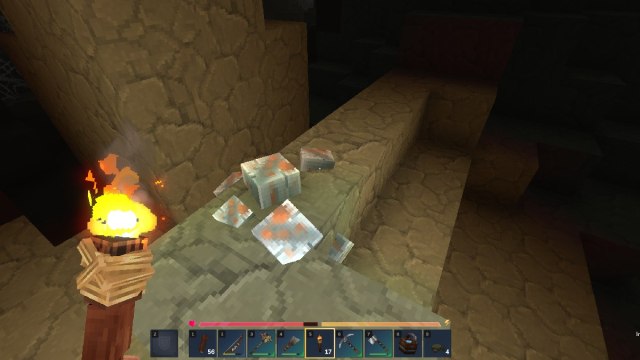 Hytale holding torch in front of iron ore block