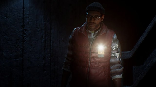 simon ordell standing in dwsp with flashlight in