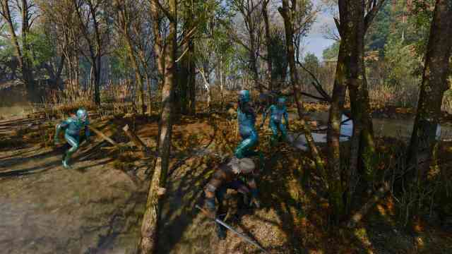 The Witcher 3 Remastered fighting three enemies grouping up
