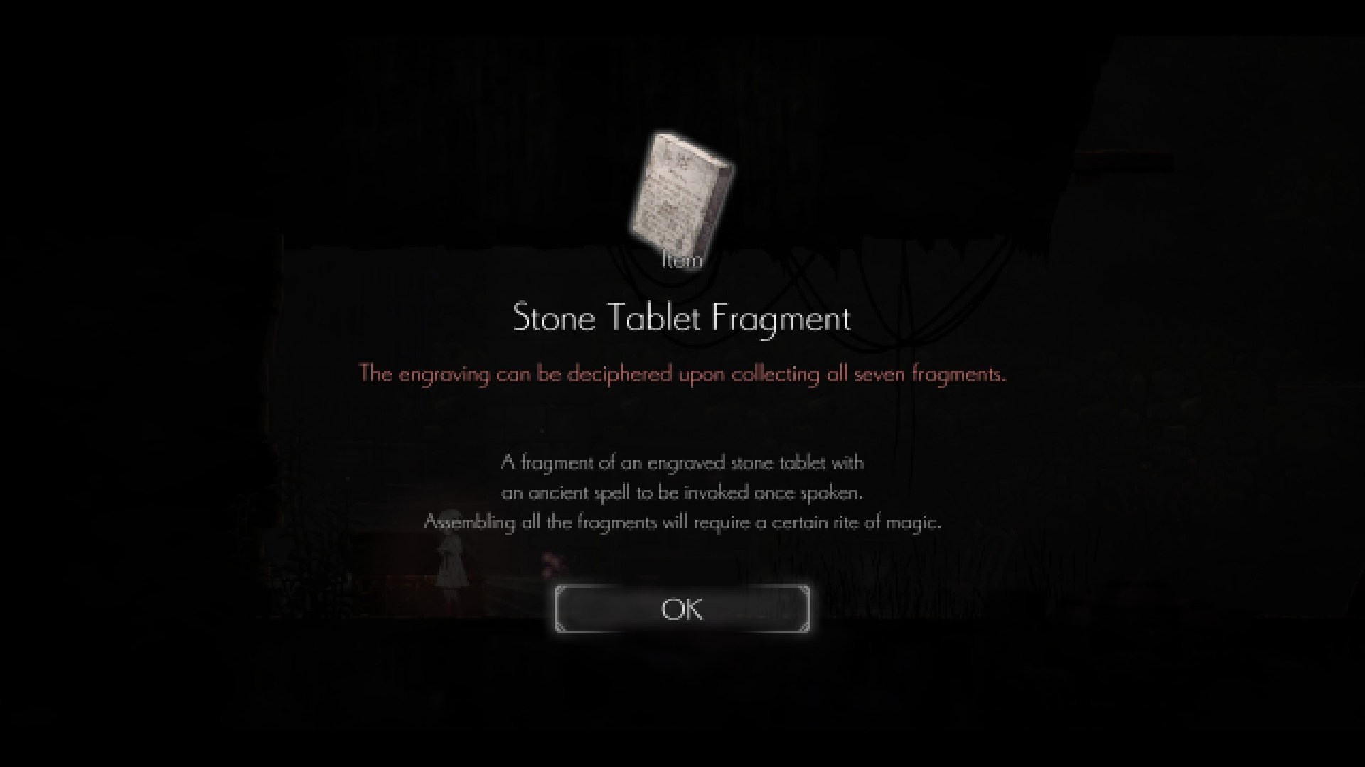Ender Lilies screenshot text: Stone Tablet Fragment item. The item can be deciphered upon collecting all seven fragments